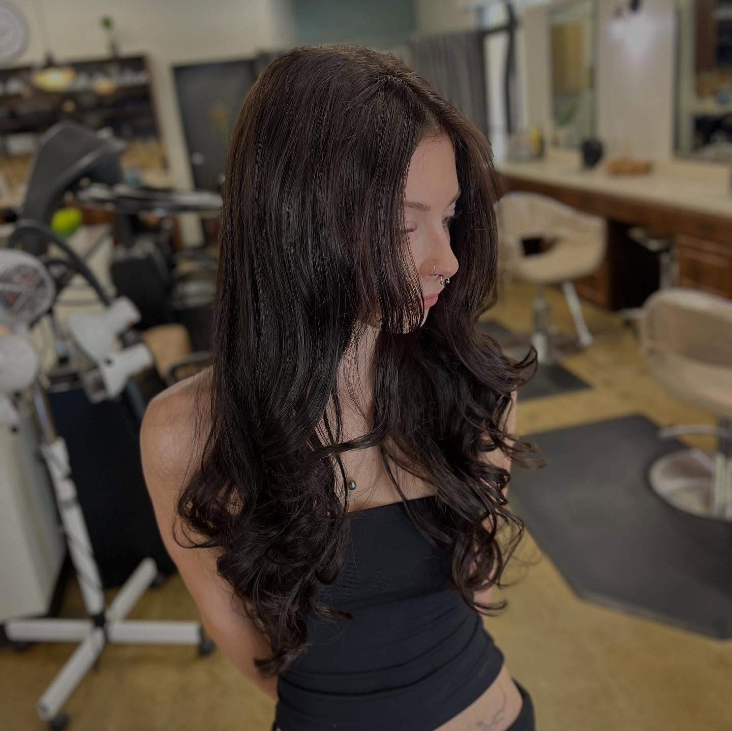 Long brunette layers with a softly curled finish