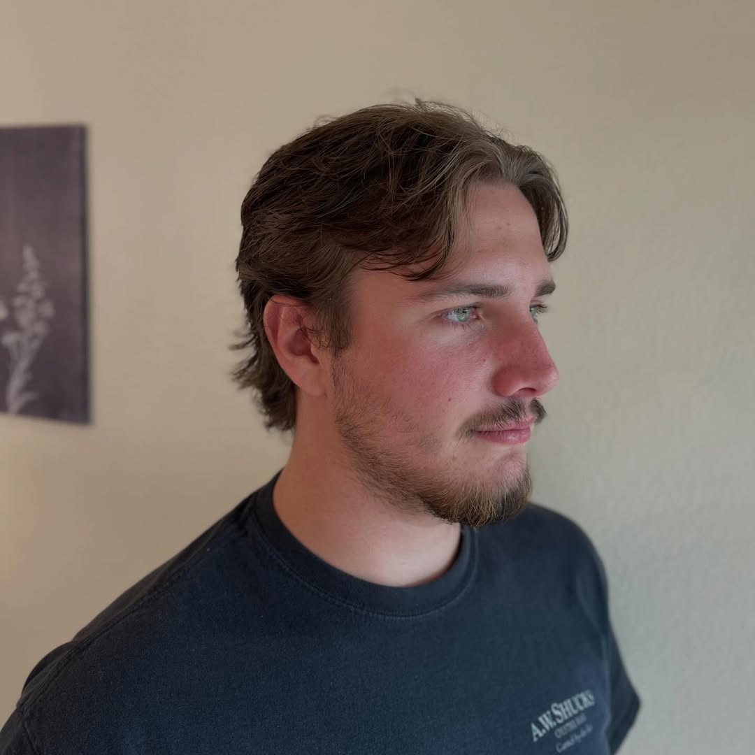 Short textured haircut with a swept-back finish